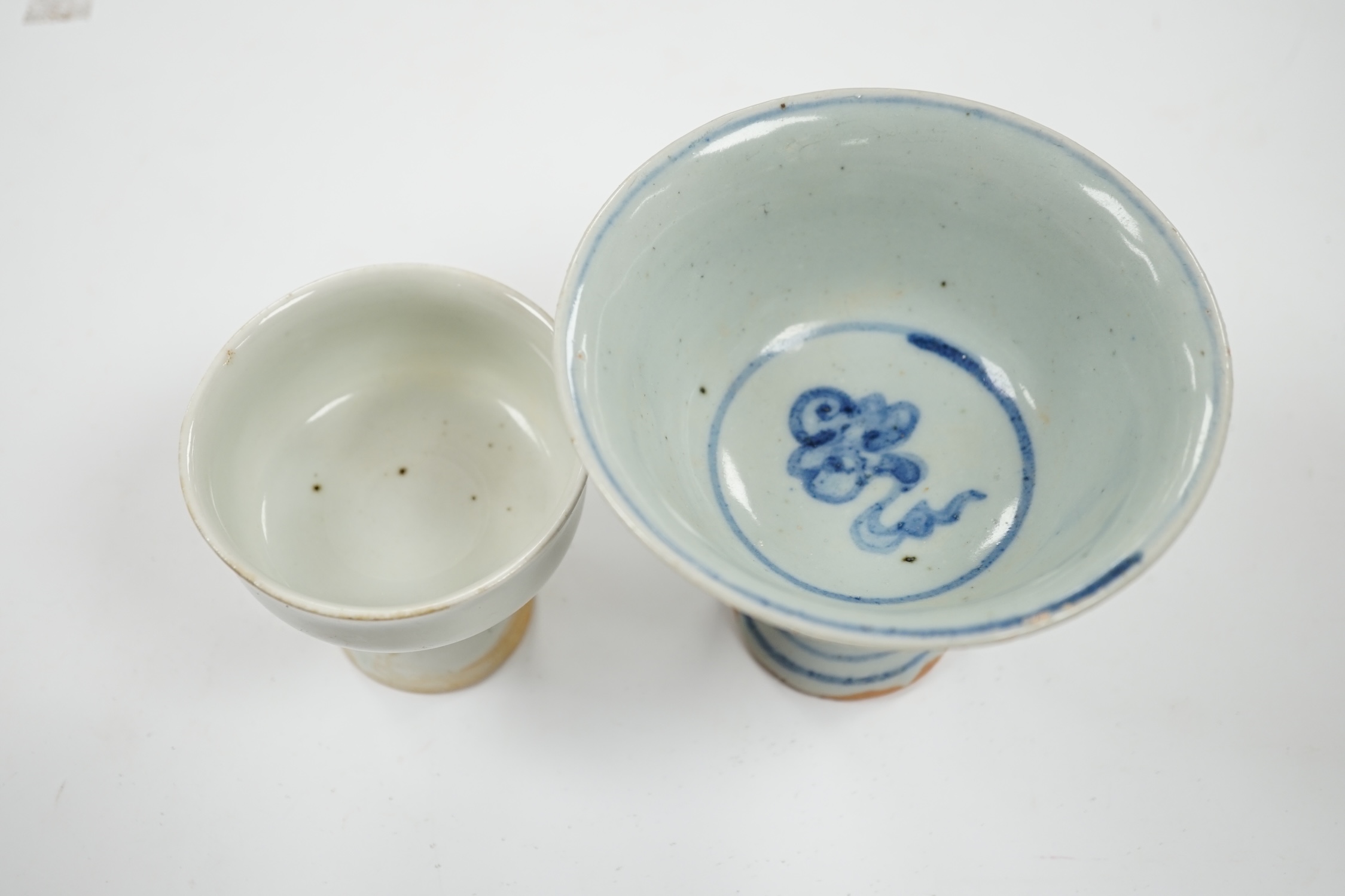 Two Chinese stem cups including a blue and white example, 10.5cm. Condition - fair to good